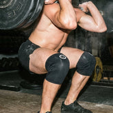 Athlete wearing Mammal V3 7mm knee sleeves mid heavy squat