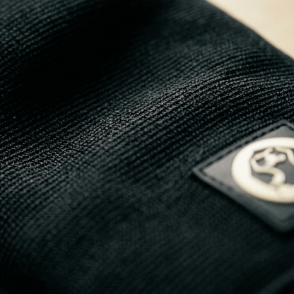 Close up of Mammal Strength 3mm double ply knee sleeves showing compression fabric texture and logo